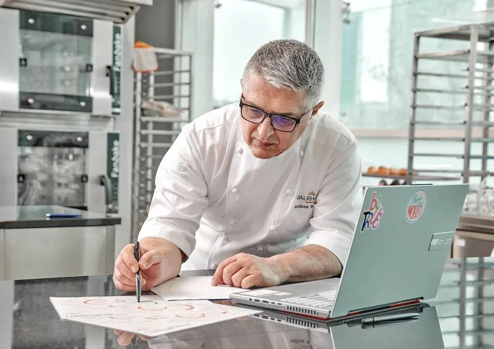 Andrea Bandiera takes technical notes during a consulting session in the lab.